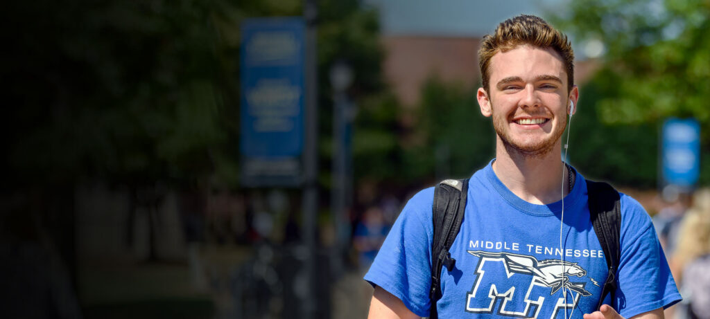 MTSU student walking across campus promoting summer and winter classes at Middle Tennessee State University.
