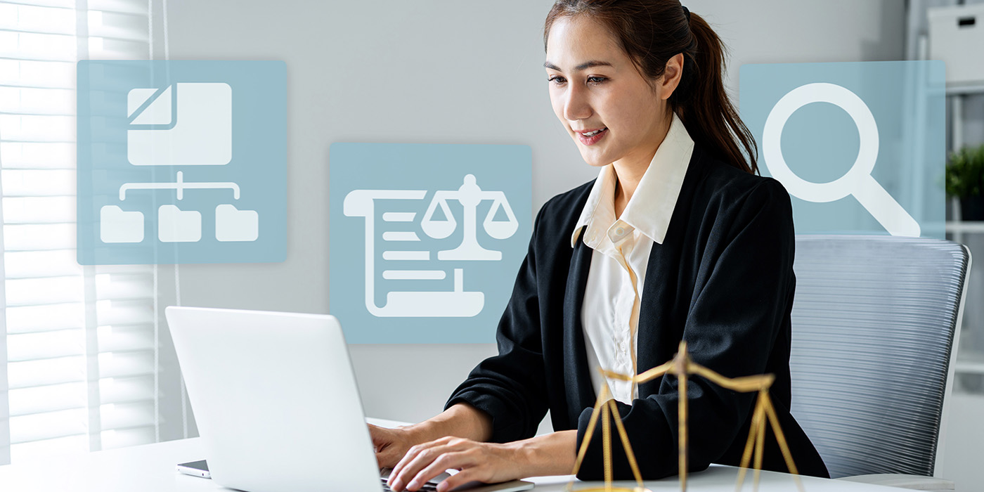 Person working on a laptop with legal research, document, and justice icons representing paralegal work.